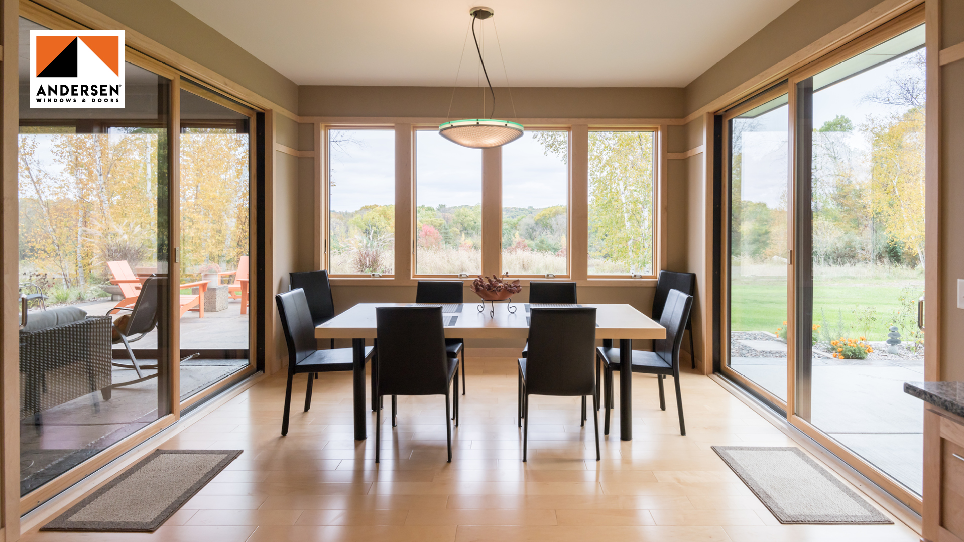 Dining room with large Andersen windows and patio doors